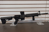 Battle Arms Development BAD-15 AR-15 rifle equipped with Vortex SPARC red dot sight, LaRue Tactical grip, and Magpul stock.