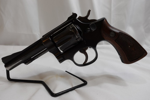 1951 S&W K-22 COMBAT MASTERPIECE, 5 SCREW, 4" BARREL REVOLVER WITH VINTAGE BRAUER BROTHERS LEATHER HOLSTER