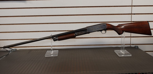 1949 ITHACA MODEL 37 12 GA 2 3/4" FACTORY ENGRAVED GAME SCENE, Ithaca Model 37 1949 engraved shotgun, Ithaca 37 game scene engraving, vintage Ithaca pump shotgun, bottom eject shotgun detail, Ithaca 12 gauge wood stock, engraved receiver close up