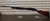 Winchester Model 12 1930 shotgun, vintage Winchester pump 12 gauge, Model 12 field grade side view, pre war Winchester shotgun, classic wood stock shotgun, Winchester 12ga