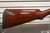 Winchester Model 12 1930 shotgun, vintage Winchester pump 12 gauge, Model 12 field grade side view, pre war Winchester shotgun, classic wood stock shotgun, Winchester 12ga