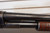 Winchester Model 12 1930 shotgun, vintage Winchester pump 12 gauge, Model 12 field grade side view, pre war Winchester shotgun, classic wood stock shotgun, Winchester 12ga