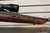 MOSSBERG 4 X 4 7MM REM MAG RIFLE W/SIMMONS SCOPE, Mossberg 4x4 rifle with Simmons scope, 7mm Rem Mag hunting rifle side view, bolt action scoped rifle close up, Mossberg hunting firearm detail, long range deer rifle, magnum bolt gun
