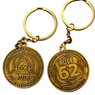 Front and back of the Rule 62 bronze coin keychain.