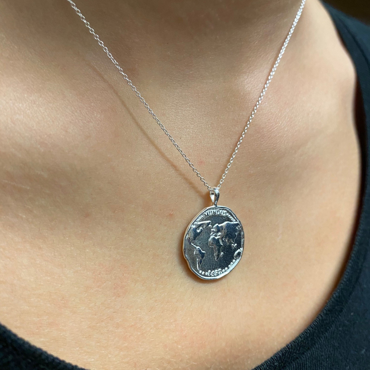 Reeves & Reeves: World Coin Pendant, tomfoolery