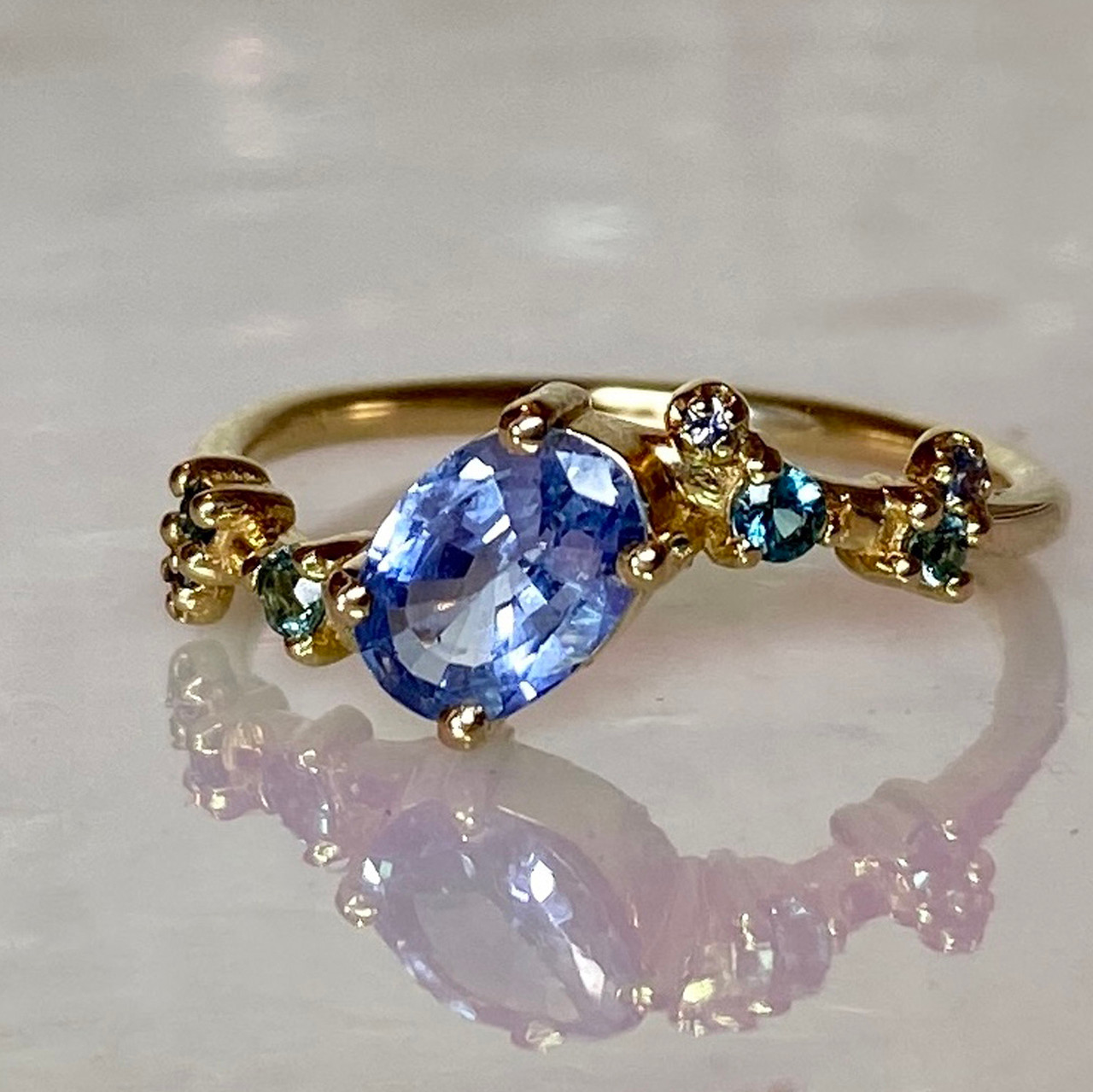 Oval Sapphire Gradient Crossover Ring, WWAKE, tomfoolery