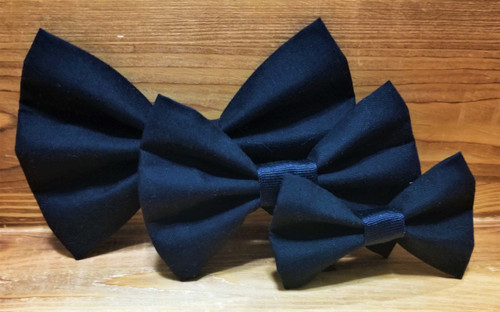 Solid black handmade pet bow tie with double elastic loops for dog collar attachment