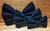 Solid black handmade pet bow tie with double elastic loops for dog collar attachment