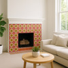 Decorative Mexican 6x6 tiles with yellow, cobalt and terracotta accents installed on a mission style family room fireplace mantel