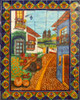 mexican tile mural with colorful colonial town