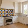 Mexican Tile "Garden Crest Tile" backsplash in bright kitchen with white cabinets