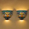 Sol del Valle Talavera Sconce illuminating a warm-toned wall with artisanal charm and intricate brushwork.