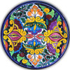 Mexican Talavera decorative plate with symmetrical colorful design inspired by traditional folk artistry.