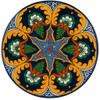 Nocturne Sol Talavera Plate featuring a radiant blue star motif surrounded by golden yellow and green details.