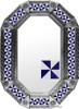 Geometric Pinwheel Tin Mirror in a natural tin frame showcasing artisan embossed metal paired with blue and white pinwheel tiles.