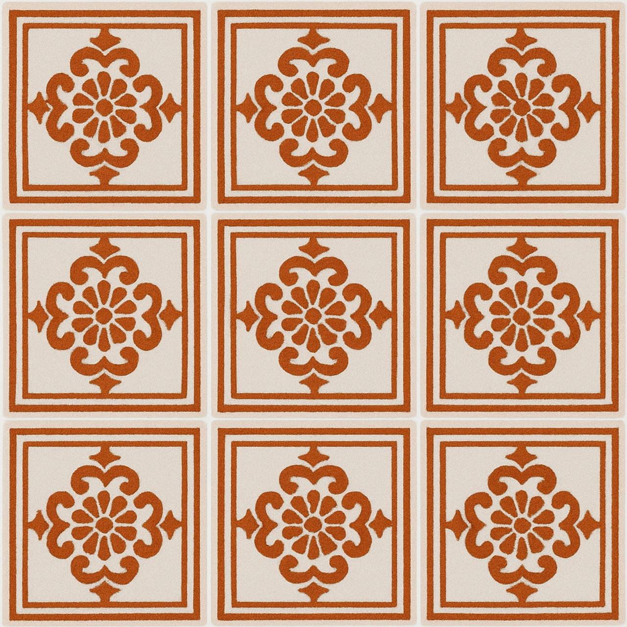 Mexican tile with rust-colored floral pattern on a white background.