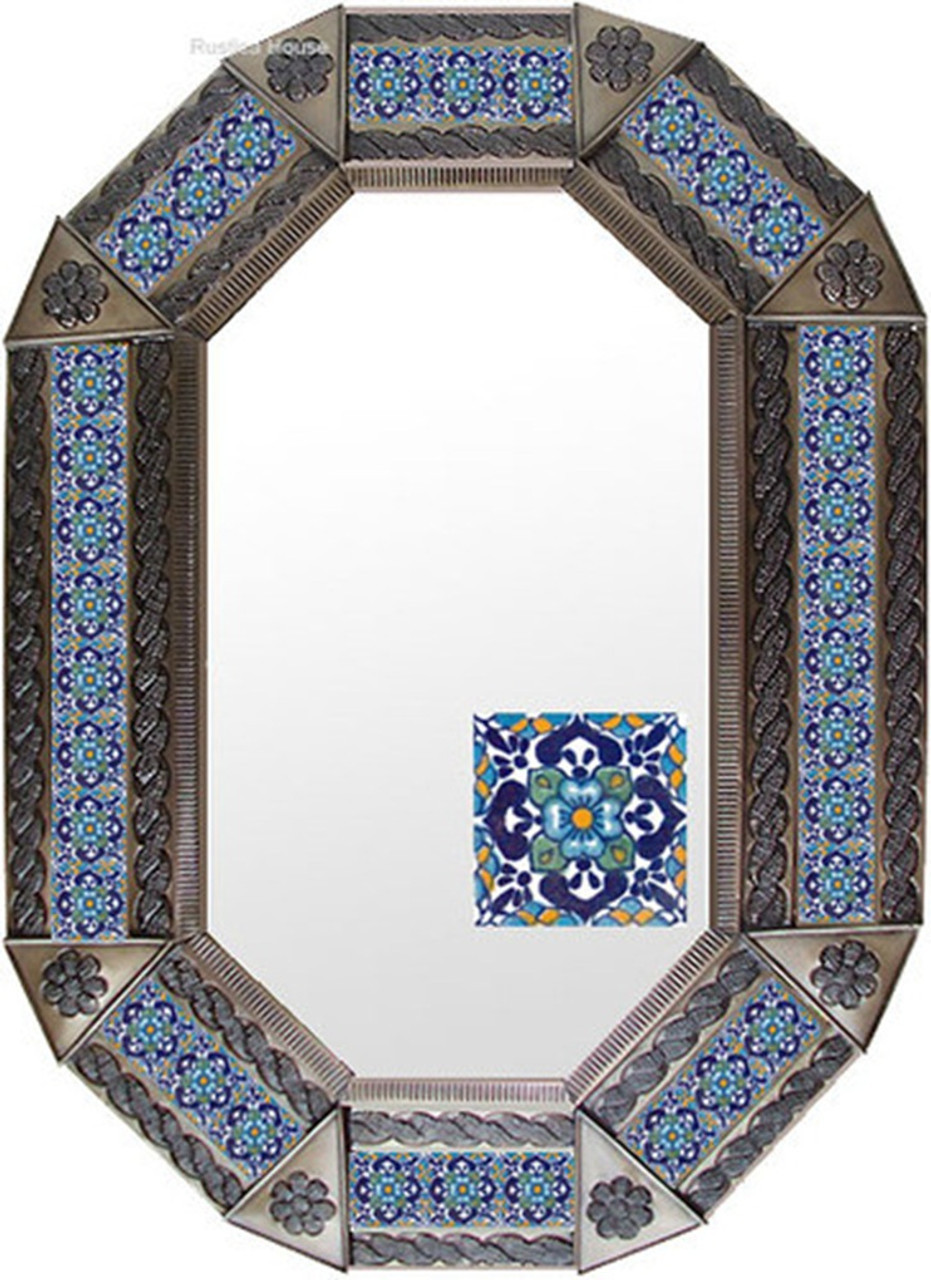 Indigo Tile Tin Mirror presented in a warm copper toned frame contrasted with striking indigo blue tile motifs for a rich handcrafted aesthetic.