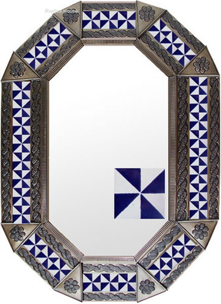 Geometric Pinwheel Tin Mirror with a warm copper tone frame highlighting the contrast of the blue and white geometric pinwheel tiles.