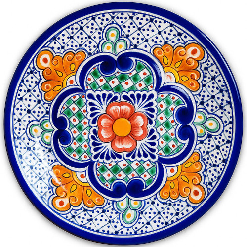 Seville Charm Talavera Plate featuring a hand-painted floral medallion in orange, green, and cobalt blue.
