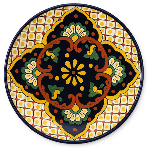 Mexican Talavera decorative plate with bold geometric symmetry and vibrant colonial-inspired palette.