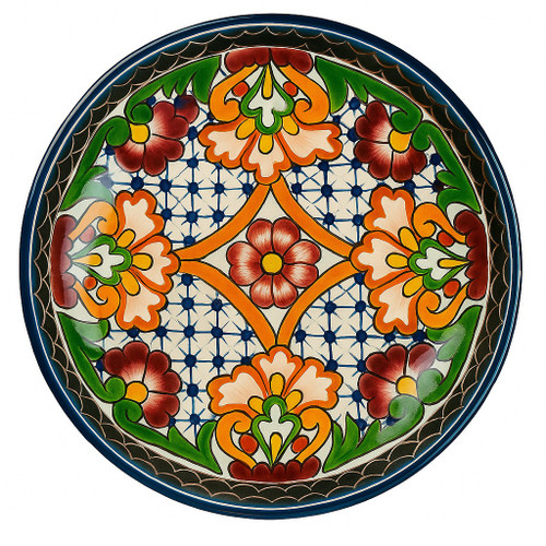 Harvest Glow Talavera Plate with hand-painted maroon, orange, and green motifs on a cobalt grid background.