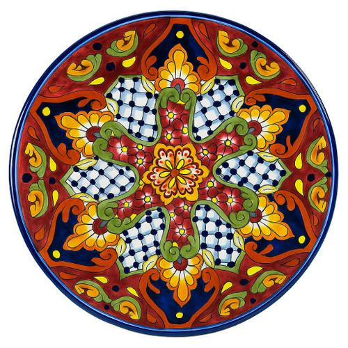 Dolores Glow Talavera Plate featuring a radiant red background with yellow, green, and cobalt geometric motifs.