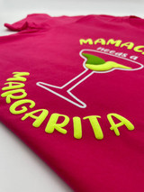 Image of magenta shirt with a logo that reads “Margarita” in yellow Easy Puff underneath a margarita glass filled with yellow and lime shapes mimicking the drink.