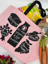 Image of a pink shopping bag with black handles showing five shapes: milk bottle, meat, loaf of bread, grapes and carrots using Blackboard Heat Transfer Material. All shapes have grocery items correlating to the shape listed using chalk.