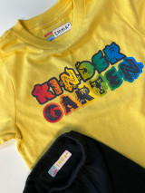 Image of a yellow shirt with logo the reads "Kindergarten" printed in EasyColor DTV and black pants with printed label made with EasyColor DirectToVinyl