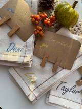 Image of three tan napkins side-by-side using Cornflower Blue to spell “Dani”, Gold Star to spell “Lisa” and Midnight Black to spell “Taylor” Sparkle alongside brown cardstock with Gold Star reading “… I am grateful you are here …”