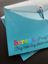Closeup Image of a turquoise folder and the logo “Scraps. Proof… They have tiny ideas…” using rainbow colors of EasyPSV Starling.