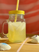 Image of a clear mason jar with a yellow top and straw and a logo of a “starfish” and “Beach Bum” using EasyPSV Etch Light.