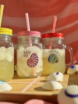 Image of three mason jars with different colored caps and straws and logos of “Shells” and “Funny Words” using EasyPSV Glitter by Avery Dennison Hyacinth / Pink, EasyPSV Etch Light, and EasyPSV Blackboard.