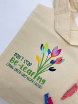 Overview of an image of a tan bag with the logo of “Don’t stop Be-Leafing. Going Green was Never Easier” using many different, spring-like EasyWeed EcoStretch colors.