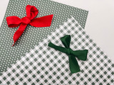 Image of our Polka Dot and Buffalo Plaid Sage Patterns with a bow on each.