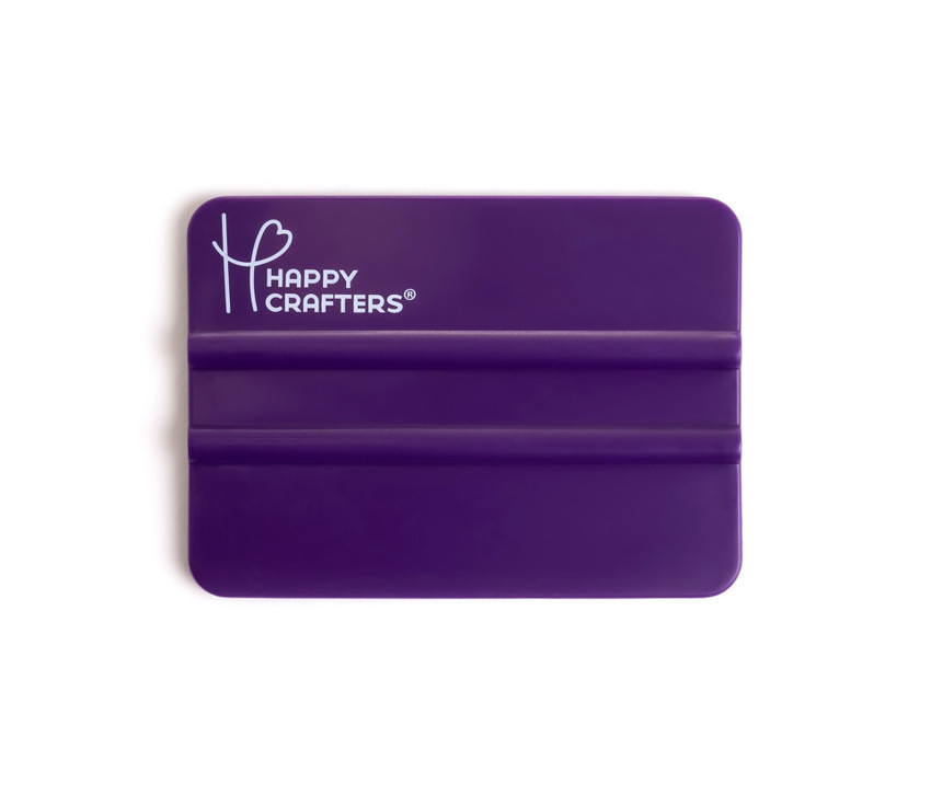 Image of a Purple Squeegee with a logo “Happy Crafters” in the upper left hand corner in White.