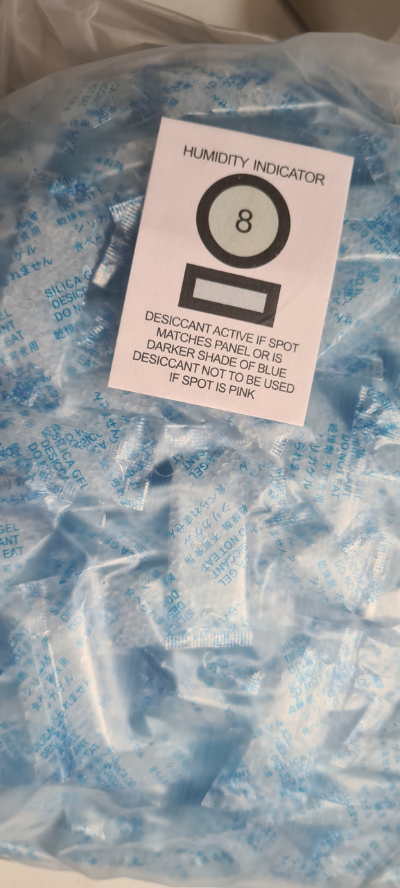 Bulk bag of 2g silica gel desiccant packets in clear OPP packaging