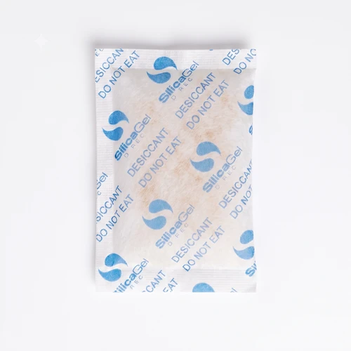 Group of orange and white indicating silica gel sachets