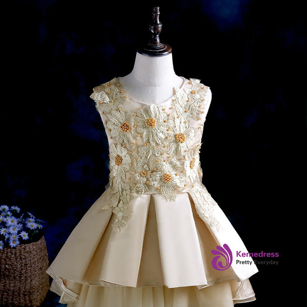 The princess's puffy dress high low gold tulle flower girl dress