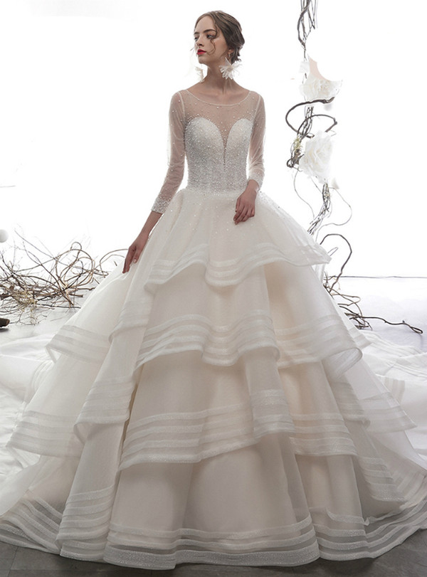 Champagne Ball Gown Long Sleeve Tulle Beading Sequins Backless Wedding Dress