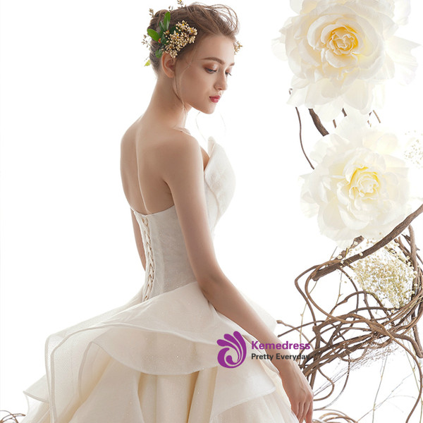 Princess Champagne Ball Gown Tulle Sequins Strapless Wedding Dress With Train