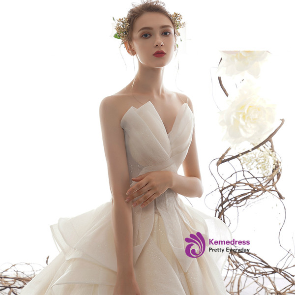 Princess Champagne Ball Gown Tulle Sequins Strapless Wedding Dress With Train