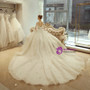 White Ball Gown Long Sleeve Backless Tulle Wedding Dress