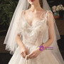 Light Champagne Ball Gown Tulle Sleeveless Spaghetti Straps Wedding Dress With Pearls