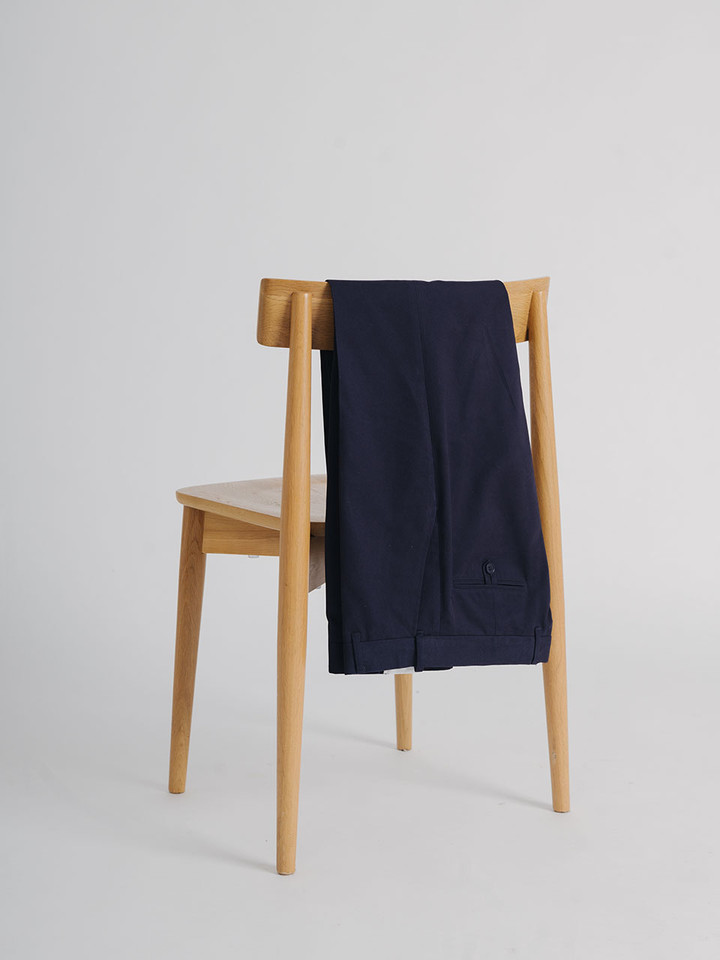 Men's Navy Blue Flat Front Chino Pants on Chair