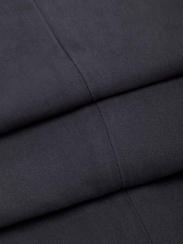 Model wears Men's Navy Blue Cotton Pleated Dress Shorts fabric