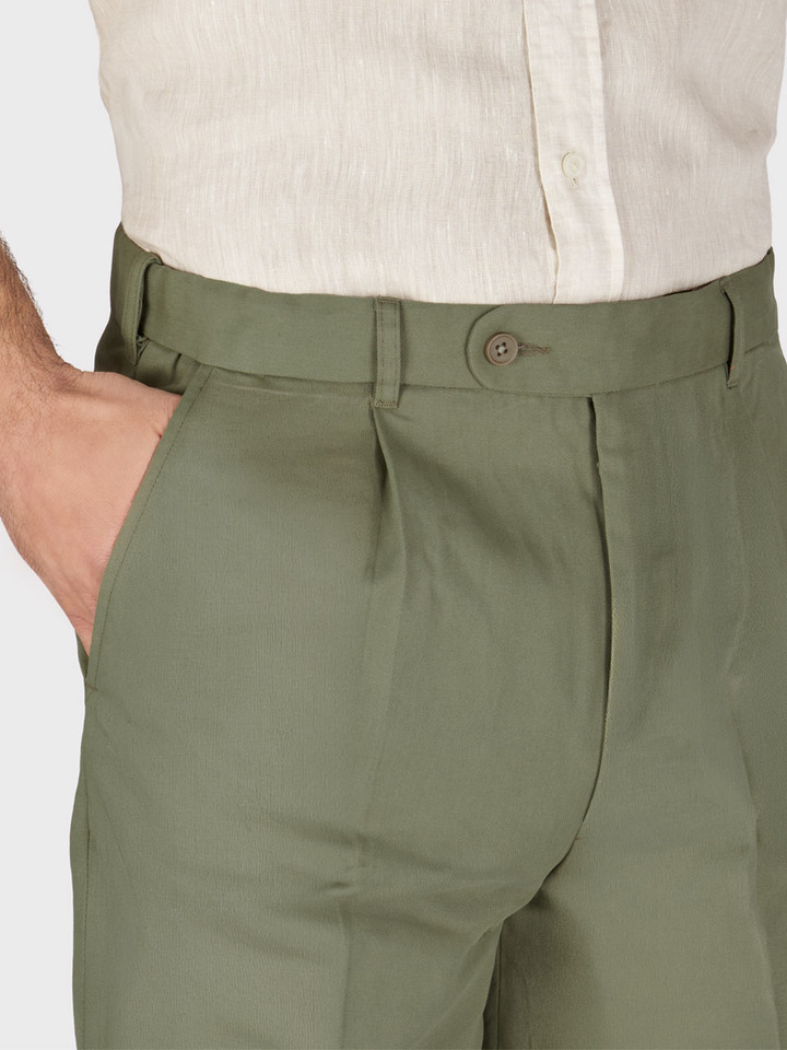 Model wears Men's Green Cotton Pleated Dress Shorts Front Pockets