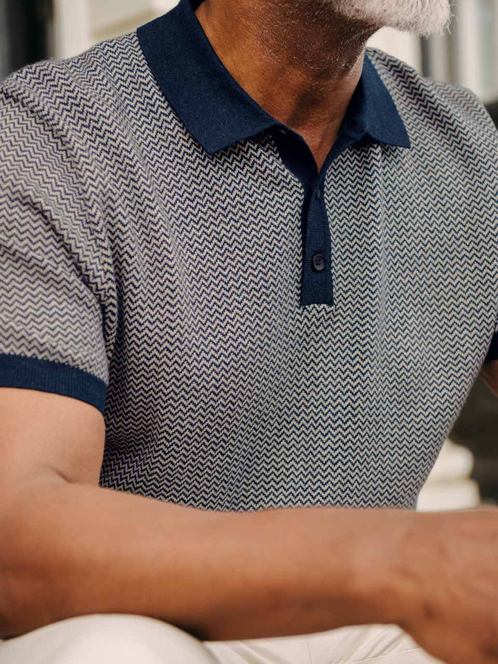 Model wears Navy & Stone Knitted Polo Shirt