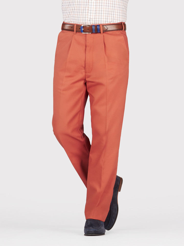 Mens Terracotta Pleated Chino Pants on Model Legs