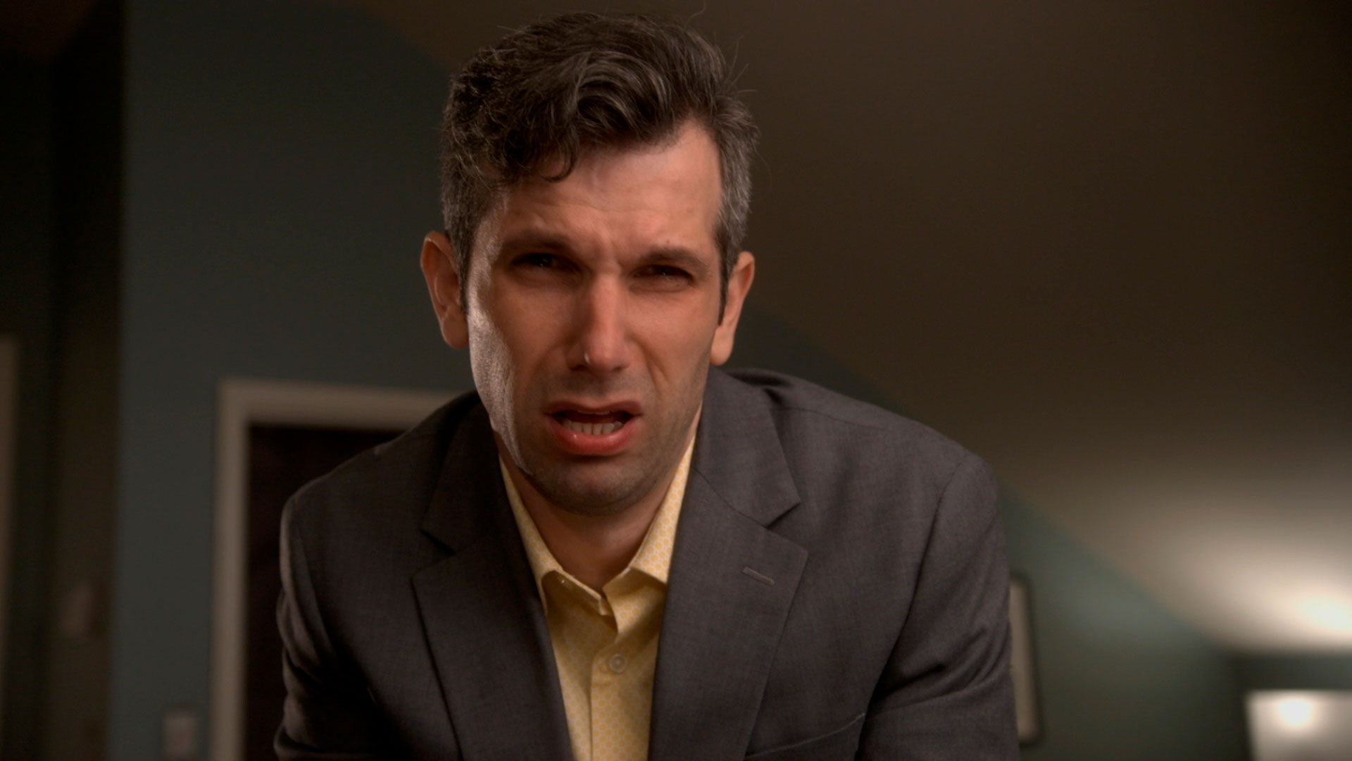 man making a face as if he smelled something terrible